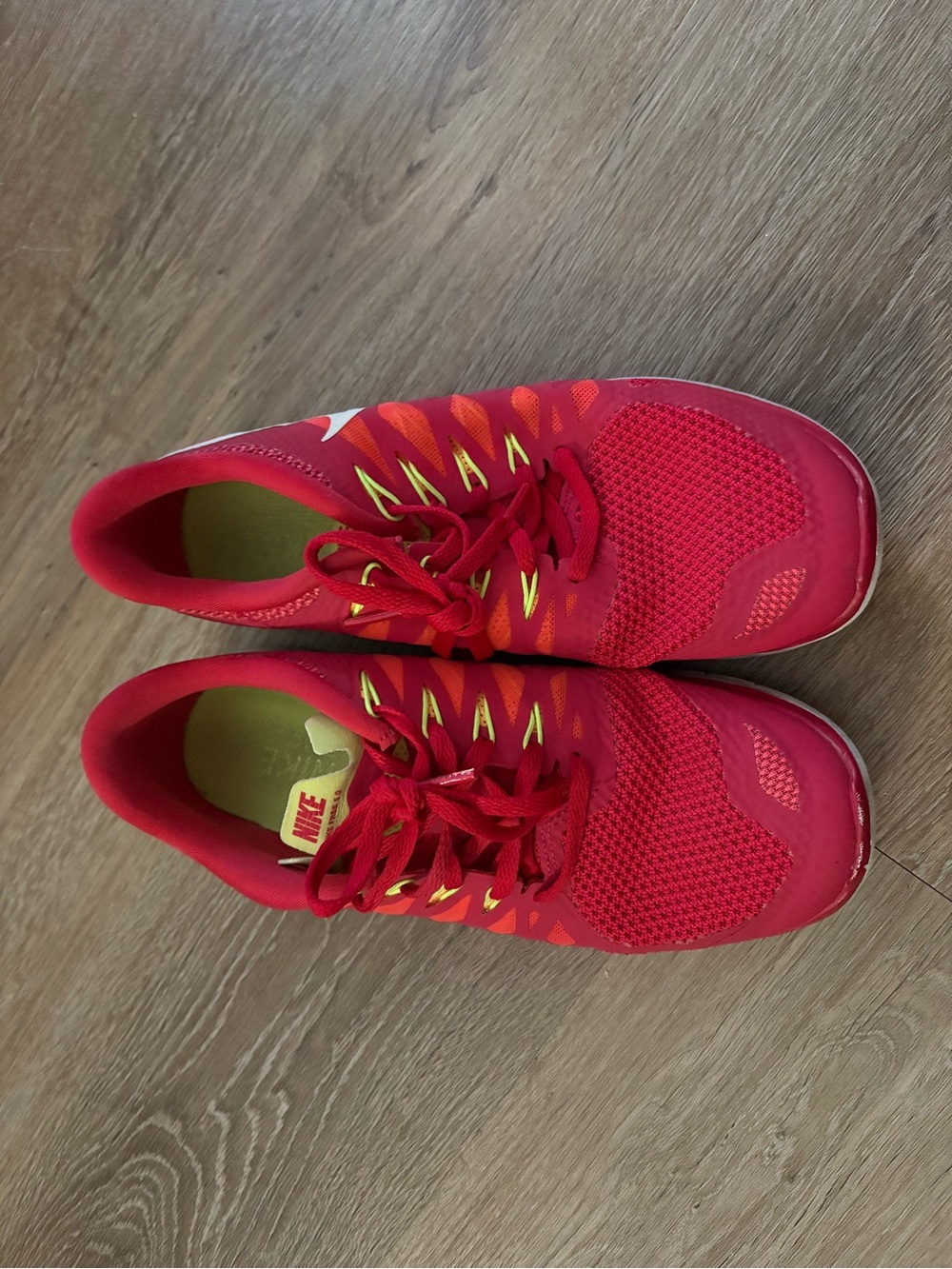 Nike Women's Bright Red Athletic Sneakers with Yellow Accents